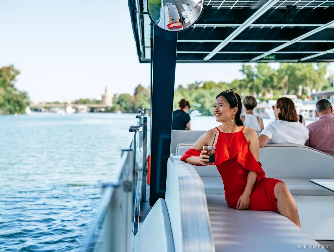 Seville Guadalquivir River Eco Cruise boat sailing past the Torre del Oro